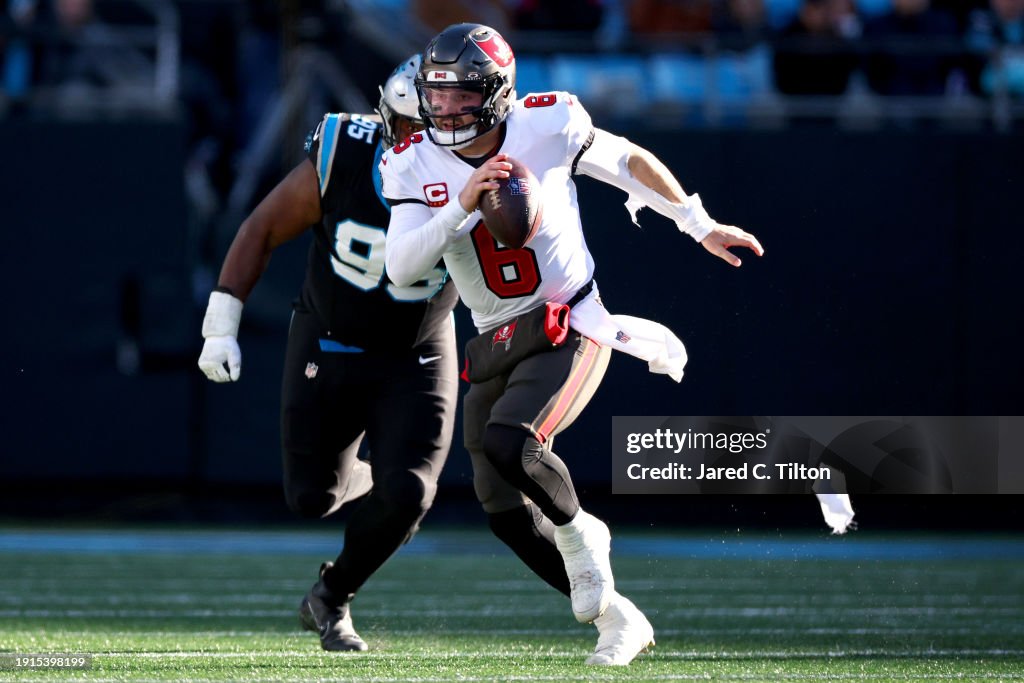  Baker Mayfield #6 of the <b><a  data-cke-saved-href='https://www.vavel.com/en-us/data/tampa-bay-buccaneers' href='https://www.vavel.com/en-us/data/tampa-bay-buccaneers'>Tampa Bay Buccaneers</a></b> runs with the ball during the fourth quarter against the <b><a  data-cke-saved-href='https://www.vavel.com/en-us/data/carolina-panthers' href='https://www.vavel.com/en-us/data/carolina-panthers'>Carolina Panthers</a></b> at Bank of America Stadium on January 07, 2024 in Charlotte, North Carolina. (Photo by Jared C. Tilton/Getty Images)