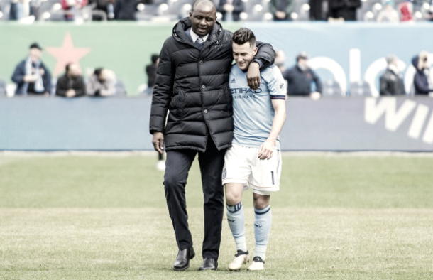 Jack Harrison in the arms of Arsenal legend, Patrick Vieira. | Photo: Matt Kremkau