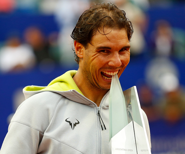 Rafael Nadal bites his 2015 Buenos Aires Trophy. Photo: Gabriel Rossi/Getty Images