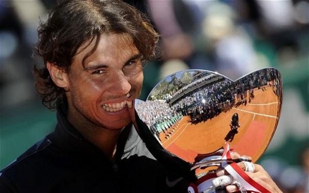 Nadal bites his eighth Monte Carlo trophy back in 2012. Photo: Reuters
