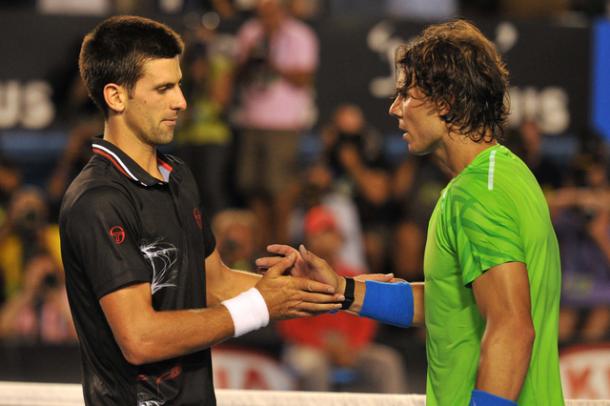 Djokovic (right) and Nadal shake hands after their nearly six hours Australian Open final in 2012. Photo: AFP