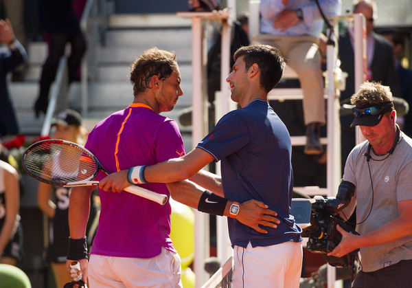Nadal (left) and Djokovic shake hands after their Madrid semifinal. Photo: Denis Doyle/Getty Images