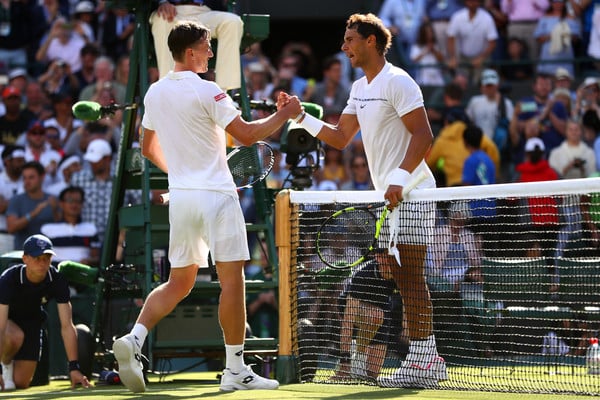 Nadal (right) and Millman shake hands after the Spaniard's victory. Photo: Michael Steele/Getty Images