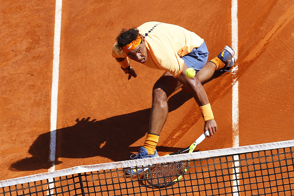 Rafael Nadal slides to retrieve a drop shot. Photo: Valery Hache/AFP/Getty Images