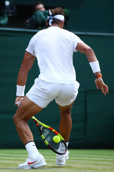 Rafael Nadal flicks a tweener over the head of de Minaur. He won the point when the Aussie missed his own tweener. Photo: Clive Brunskill/Getty Images