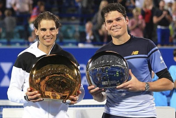 Raonic (right) and Rafael Nadal hold their trophies after their 2016 Abu Dhabi final. Photo: Reuters