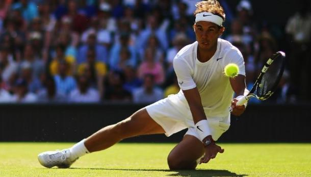 Rafael Nadal lunges for a shot at Wimbledon. Photo: Al Bello/Getty Images