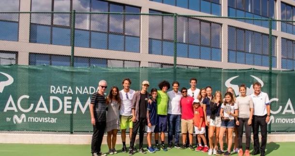 Nadal (centre, in white) poses with a group at his academy. Photo: Rafael Nadal twitter