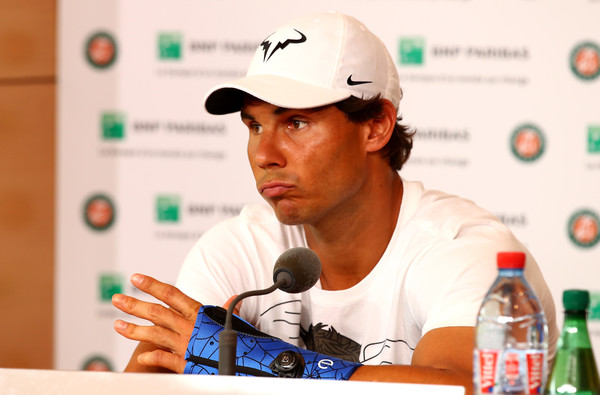 Rafael Nadal wearing a cast during his withdrawal press conference. Photo: Clive Brunskill/Getty Images