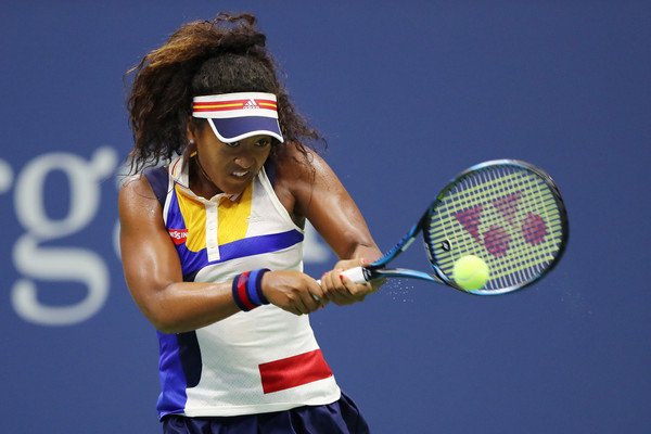 Naomi Osaka hits a backhand during her first-round match against Angelique Kerber at the 2017 U.S. Open. | Photo: Elsa/Getty Images
