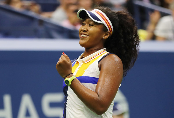 A happy Naomi Osaka celebrates after defeating Angelique Kerber in the first round of the 2017 U.S. Open. | Photo: Elsa/Getty Images