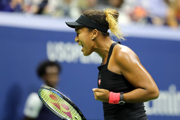 Naomi Osaka being fired up during the match | Photo: Elsa/Getty Images North America