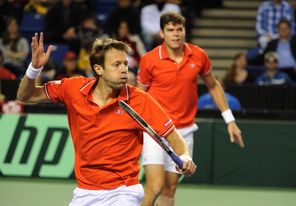 Daniel Nestor hits a volley during a doubles rubber in 2012. Photo: Don MacKinnon/AFP/Getty Images