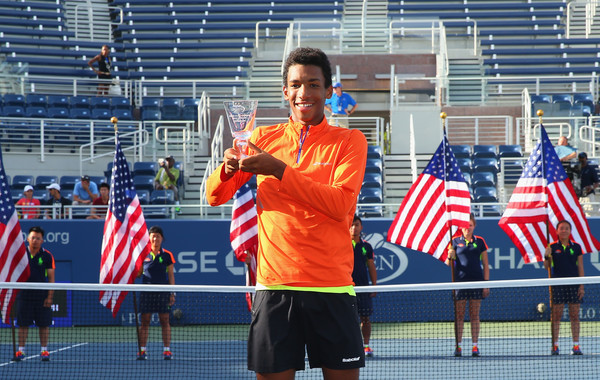 Felix Auger-Aliassime holds his 2016 US Open boys trophy.  Photo: Mike Stobe/Getty Images