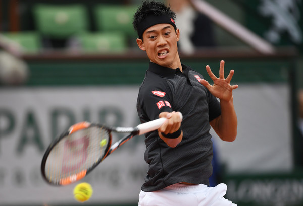 Kei Nishikori hits a forehand at the French Open. Photo: Dennis Grombkowski/Getty Images