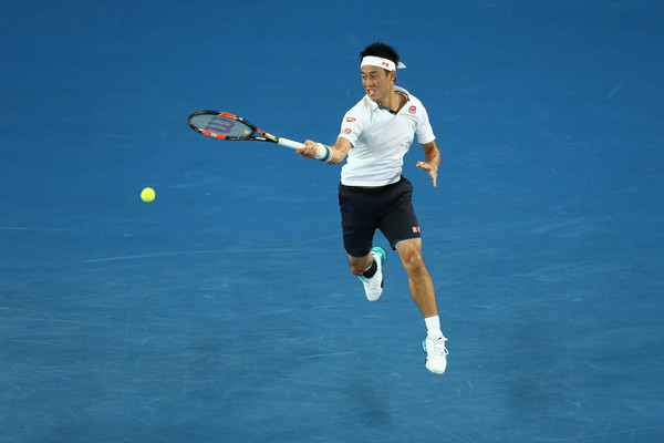 Kei Nishikori strikes a leaping forehand during his match with Krajicek. Photo: Cameron Spencer/Getty Images