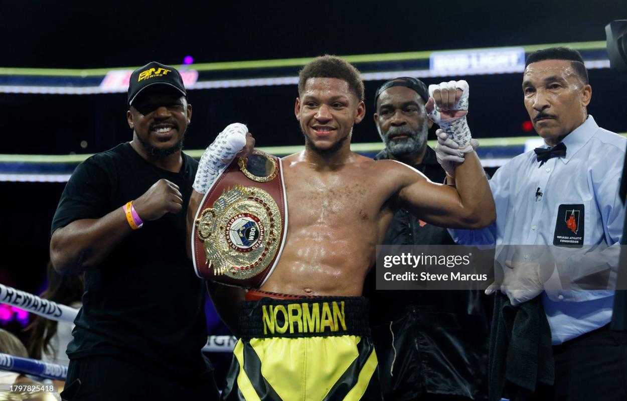 LAS VEGAS, NEVADA - NOVEMBER 16: Brian Norman Jr. (C) poses with referee Tony Weeks (R) after defeating Quinton Randall in a welterweight bout on November 16, 2023 in Las Vegas, Nevada. (Photo by Steve Marcus/Getty Images)