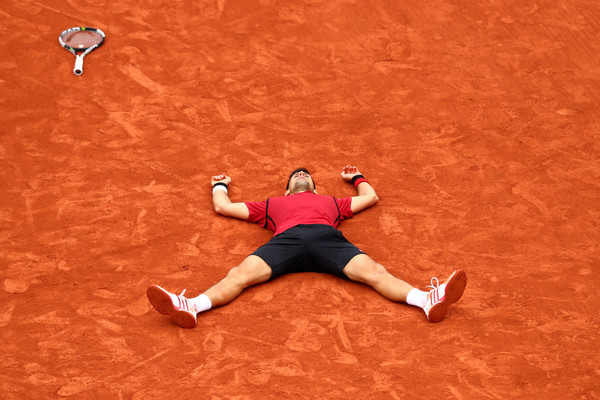 Djokovic soaks in the scale of his achievement at the French Open in 2016 (Photo: Julian Finney/Getty Images Europe)