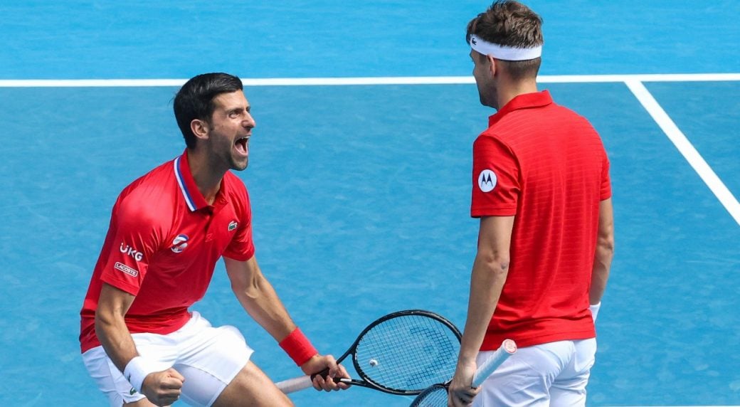 Djokovic (l.) celebrates with Krajinovic (r.) as Serbia came through their opening ATP Cup tie/Photo: Hamish Blair/Associated Press