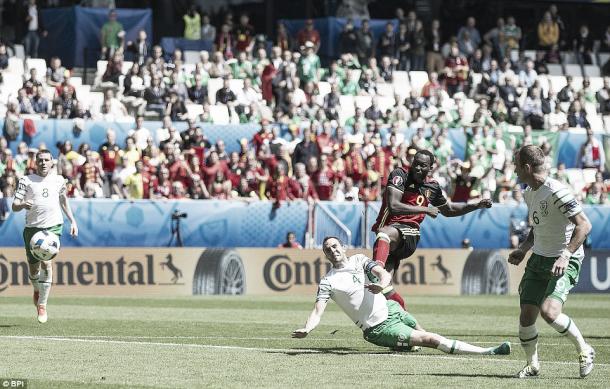 Above: John O'Shea sliding in on Romelu Lukaku in Ireland's 3-0 win over Belgium | Photo: BPI