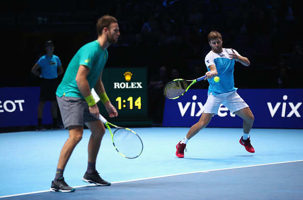 Ryan Harrison fires a forehand with Michael Venus ready to react (Photo: Clive Brunskill/Getty Images)