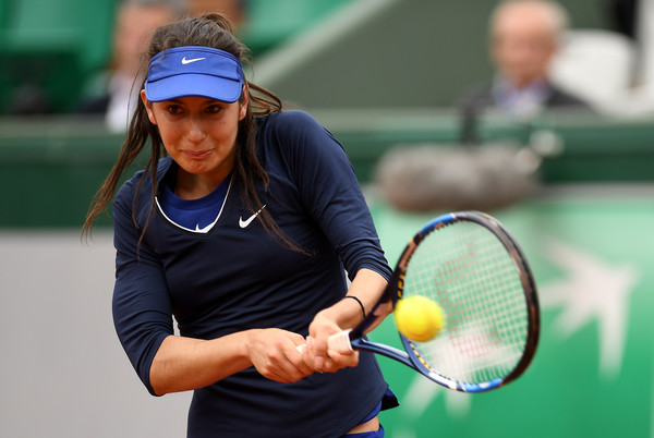 Océane Dodin hits a backhand during her first round match against Ana Ivanovic at the 2016 French Open. | Photo: Dennis Grombkowski/Getty Images Europe