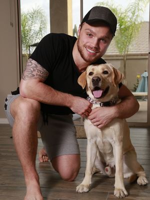 Max and his trusty diabetes dog, Orion. What a pair! (Photo: David Kadlubowski/azcentral sports)