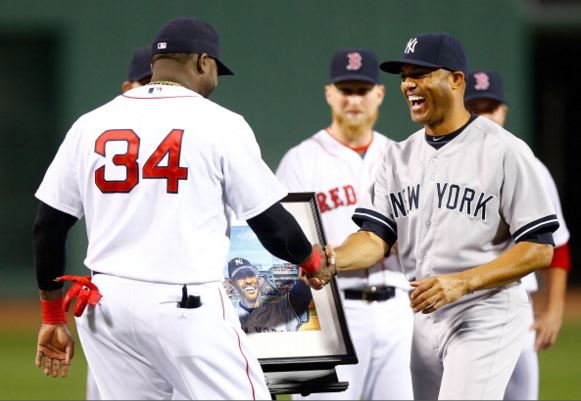 Mariano Rivera #42 of the New York Yankees is presented with a painting by David Ortiz #34 of the Boston Red Sox while being honored prior to the game against the Boston Red Sox on September 15, 2013 at Fenway Park in Boston, Massachusetts. Tonight will be Rivera's final appearance at Fenway Park as he is set to retire at the end of this season. (Photo by Jared Wickerham/Getty Images
