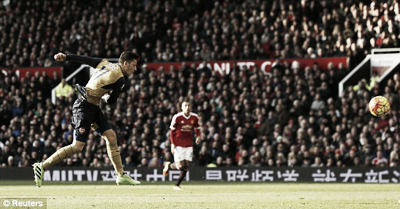 Above: Mesut Ozil scores in Manchester United's 3-2 win over Arsenal  image source: Reuters