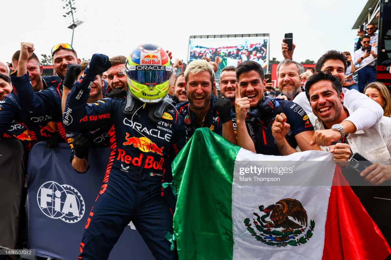 Perez celebrating with his team after winning - (Photo by Mark Thompson/Getty Images)