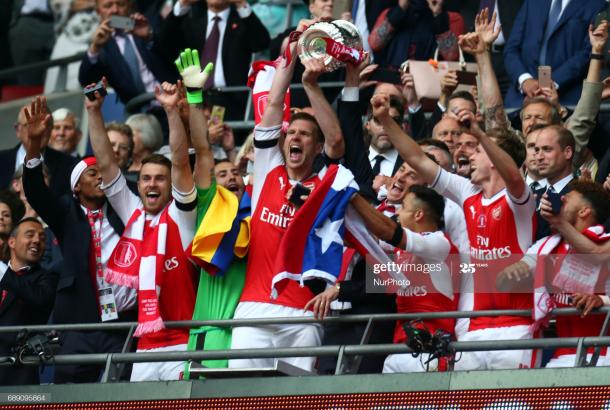 Arsenal's Per Mertesacker with Trophy during The Emirates FA Cup - Final between Arsenal against Chelsea at Wembley Stadium on May 27 2017 , England (Photo by Kieran Galvin/NurPhoto via Getty Images)