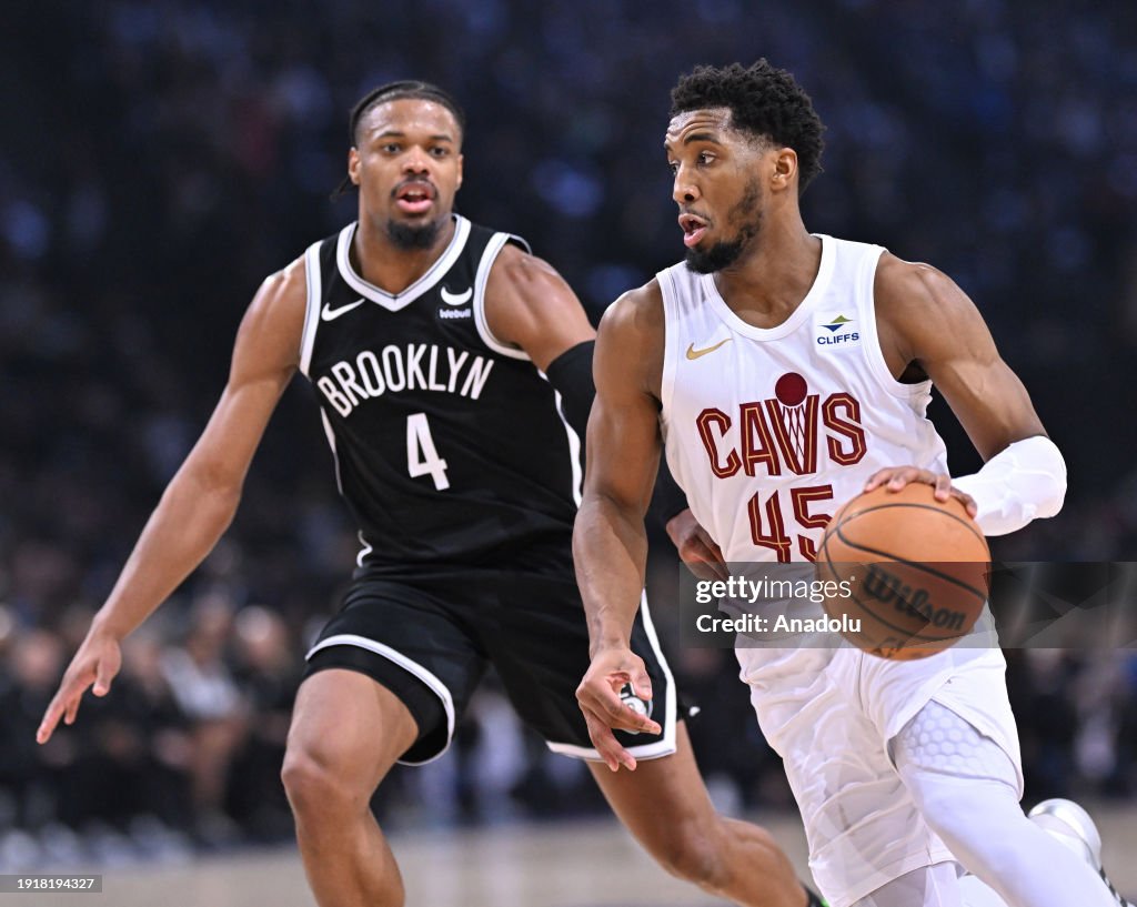 Donovan Mitchell of Cleveland Cavaliers (R) in action against Dennis Smith Jr. (L) of Brooklyn Nets during the Paris Game 2024 match between Brooklyn Nets and Cleveland Cavaliers at Accor Arena in Paris, France on January 11, 2024. (Photo by Mustafa Yalcin/Anadolu via Getty Images)