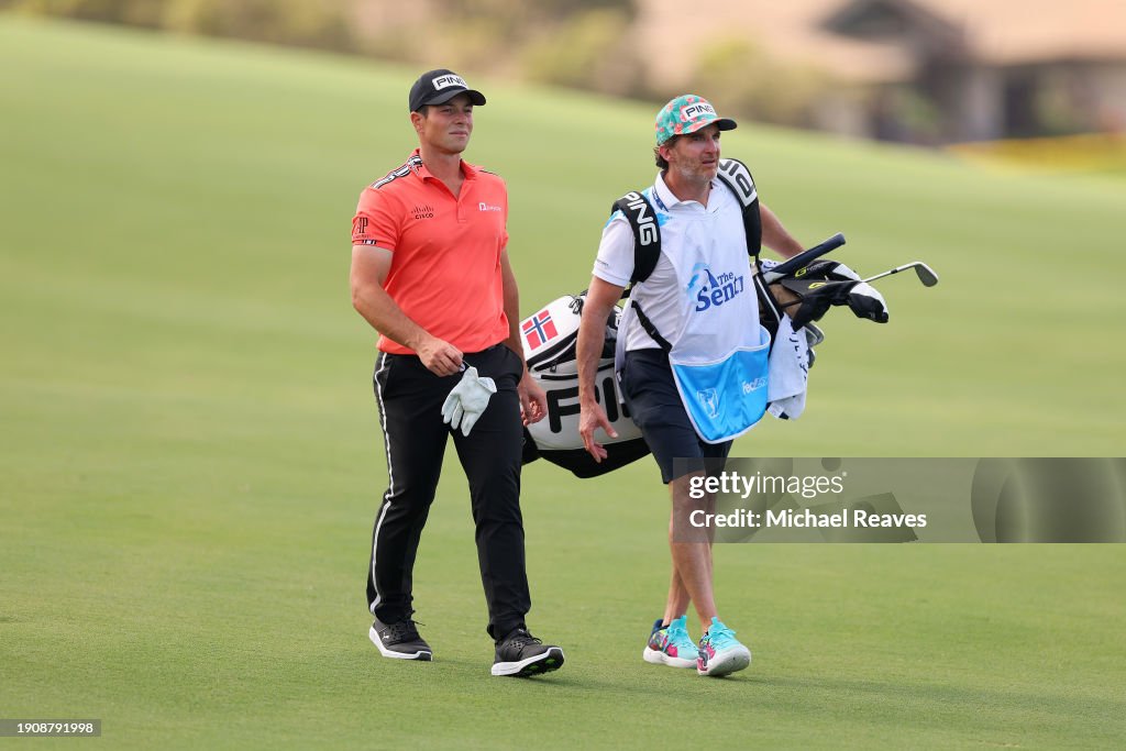 Viktor Hovland of Norway and his caddie walk the tenth hole during the first round of The Sentry at Plantation Course at Kapalua Golf Club on January 04, 2024 in Kapalua, Hawaii. (Photo by Michael Reaves/Getty Images)