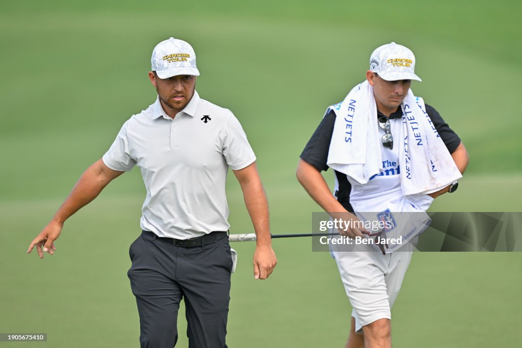 Xander Schauffele and his caddie walk off the 16th green during the third round of The Sentry at The Plantation Course at Kapalua on January 6, 2024 in Kapalua, Maui, Hawaii. (Photo by Ben Jared/PGA TOUR via Getty Images)
