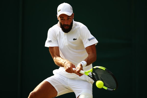 Paire crushes one of his brilliant backhands during the round two win. Photo: Clive Brunskill/Getty Images