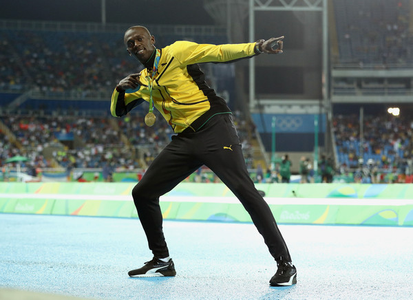 Usain Bolt celebrates another Olympic gold medal win in Rio de Janiero. Photo Credit: Patrick Smith of Getty South America