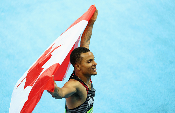 Andre De Grasse celebrates after winning the silver medal in the Men's 200-meters (Getty/Paul Gilham)