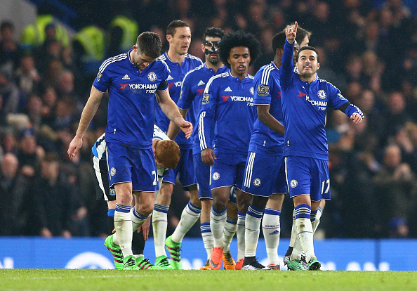 Pedro celebrates with his teammates after scoring his second, Chelsea's fourth. (Getty)