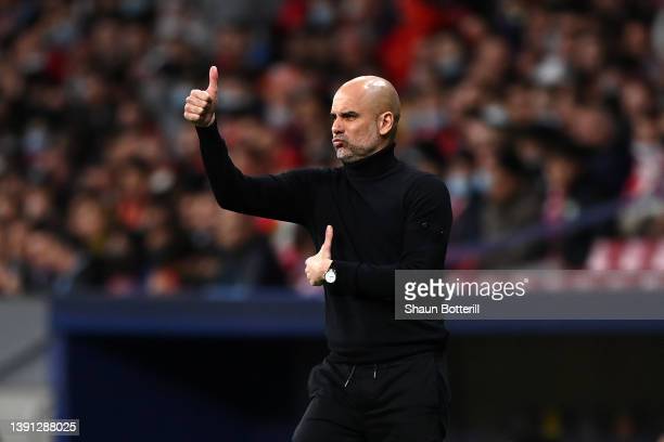 Pep Guardiola gives instructions to his players  (Photo by Shaun Botterill/Getty Images)