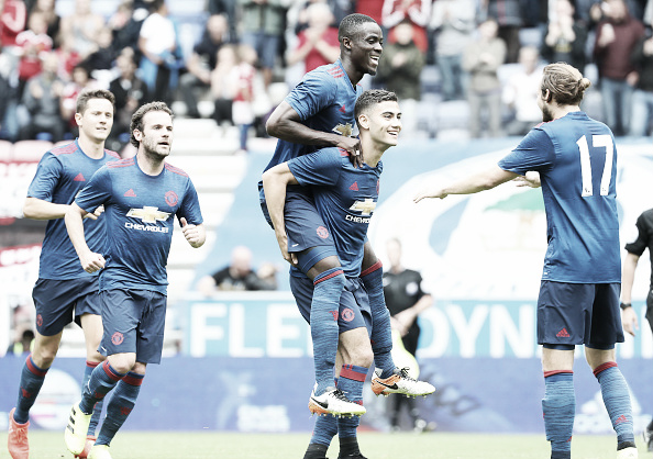 Pereira celebrates his goal with new signing Eric Bailly on his back (Photo: John Peters / Getty Images)