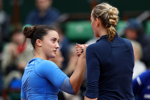 Petra Kvitova and Danka Kovinic shake hands after the match/Getty Images/Julian Finney