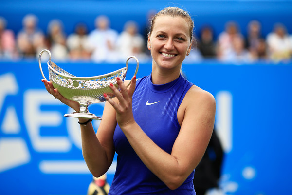 Petra Kvitova poses with the Maud Watson trophy after her heroic triumph at the Aegon Classic a couple weeks ago, just six months after a horrific knife attack at her home that almost cost her her life. | Photo: Ben Hoskins/Getty Images