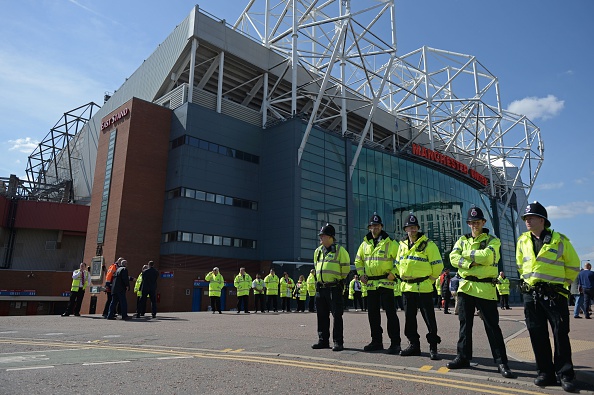 Police line a 100m radius of Old Trafford | Photo: Oli Scarff/AFP