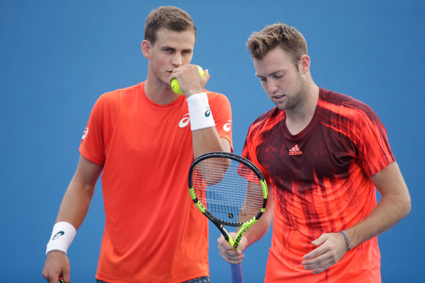 Pospisil and Sock chat during their match on Wednesday. Photo: Pat Scala/Getty Images