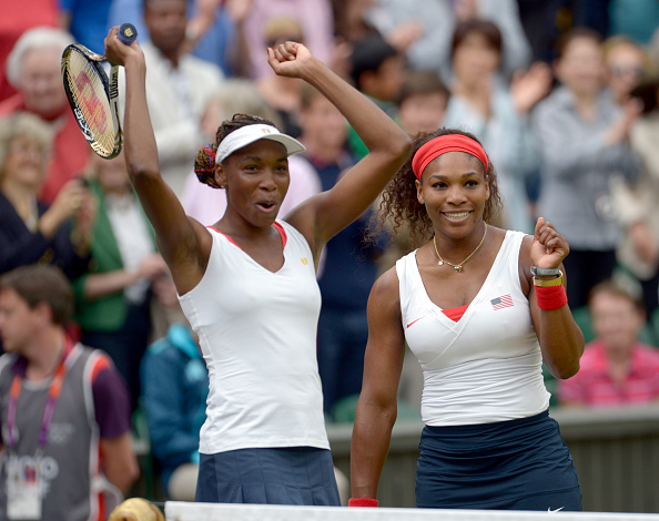 Venus and Serena Williams celebrate their third doubles gold medal in London (Image: Popperfoto)