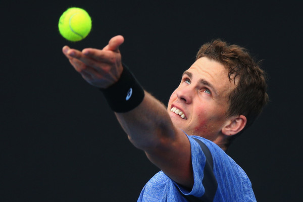 Vasek Pospisil tosses up a serve in a practice at the Australian Open. Photo: Michael Dodge/Getty Images