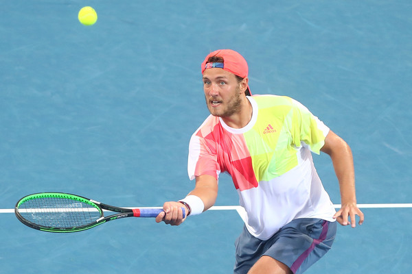 Lucas Pouille hits a forehand volley during his first round win. Photo: Chris Hyde/Getty Images