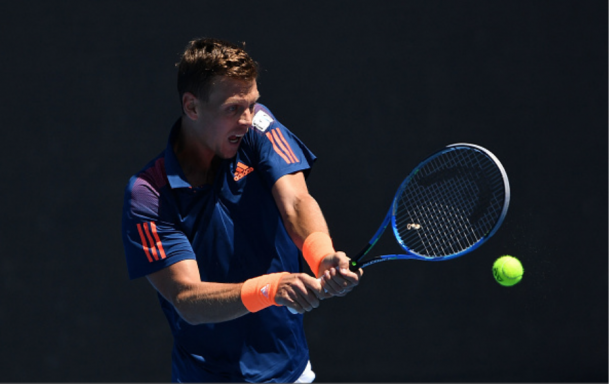 Berdych keeps his eye focused on the ball as he rips the backhand. Credit: Quinn Rooney/Getty Images