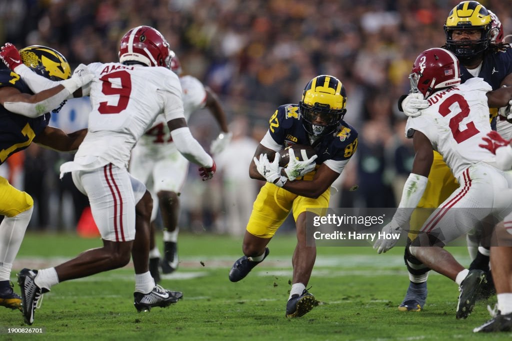  Semaj Morgan #82 of the Michigan Wolverines runs with the ball in the fourth quarter against the Alabama Crimson Tide during the CFP Semifinal Rose Bowl Game at Rose Bowl Stadium on January 01, 2024 in Pasadena, California. (Photo by Harry How/Getty Images)