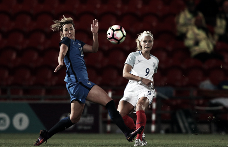 Rachel Daly flights a ball past France's Claire Lavogez (Photo: Getty/Nigel Roddis)